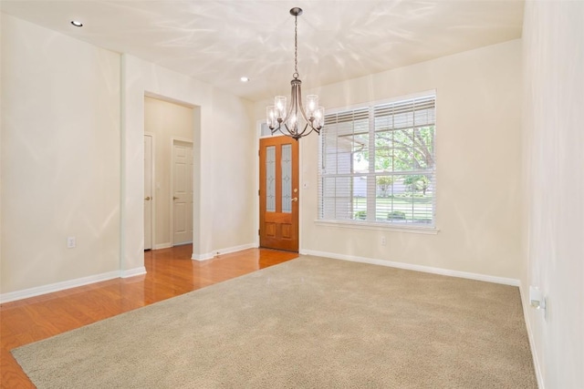 311 Dove Hollow Trl, Georgetown, TX 78633 - spare room featuring a chandelier, carpet, baseboards, and recessed lighting
