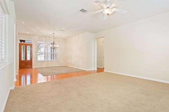 311 Dove Hollow Trl, Georgetown, TX 78633 - spare room with carpet, a chandelier, baseboards, a ceiling fan, and recessed lighting