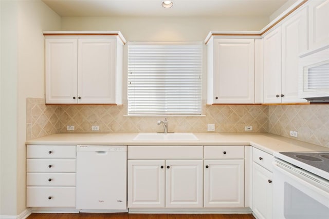 311 Dove Hollow Trl, Georgetown, TX 78633 - kitchen with white appliances, a sink, tasteful backsplash, white cabinetry, and recessed lighting