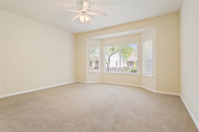 311 Dove Hollow Trl, Georgetown, TX 78633 - unfurnished room featuring light carpet, a ceiling fan, and baseboards