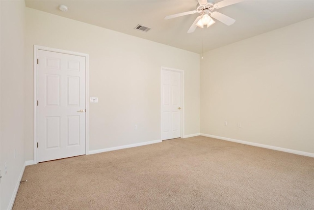 311 Dove Hollow Trl, Georgetown, TX 78633 - spare room featuring light colored carpet, ceiling fan, and baseboards