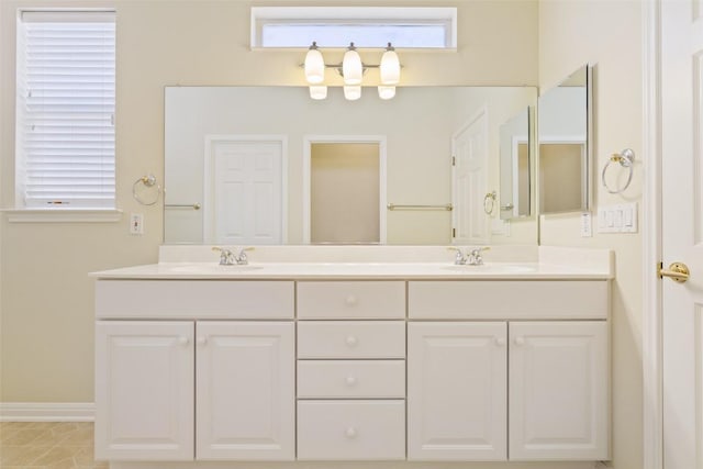 311 Dove Hollow Trl, Georgetown, TX 78633 - full bathroom with double vanity and baseboards