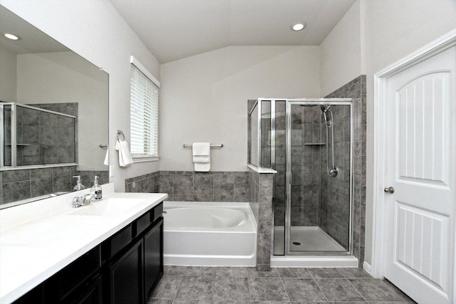 5741 Porano Cir, Round Rock, TX 78665 - full bathroom featuring a bath, a shower stall, vanity, vaulted ceiling, and recessed lighting