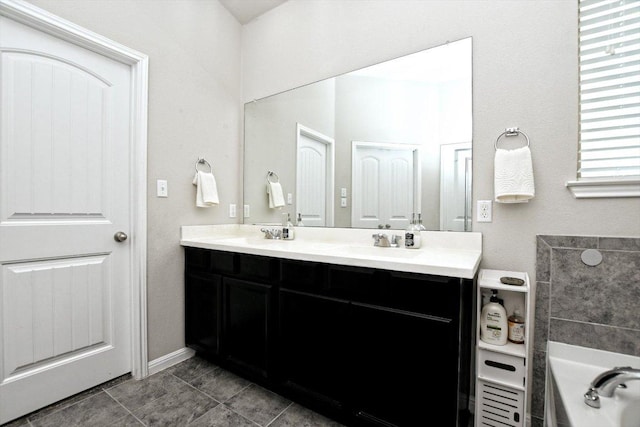 5741 Porano Cir, Round Rock, TX 78665 - full bathroom featuring double vanity, a bath, and tile patterned floors