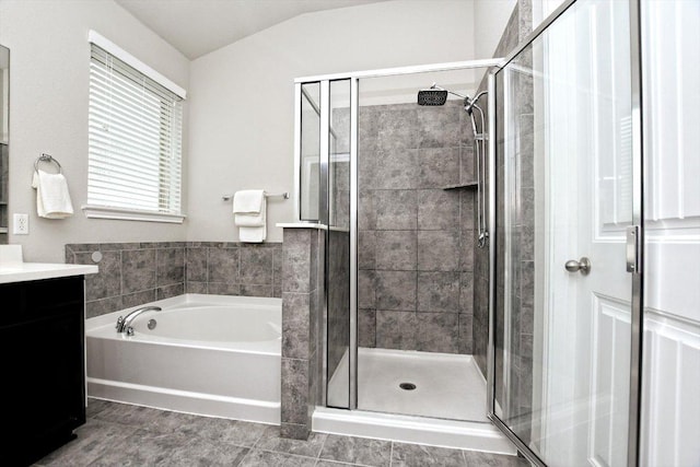 5741 Porano Cir, Round Rock, TX 78665 - full bath featuring vanity, a garden tub, a stall shower, and lofted ceiling