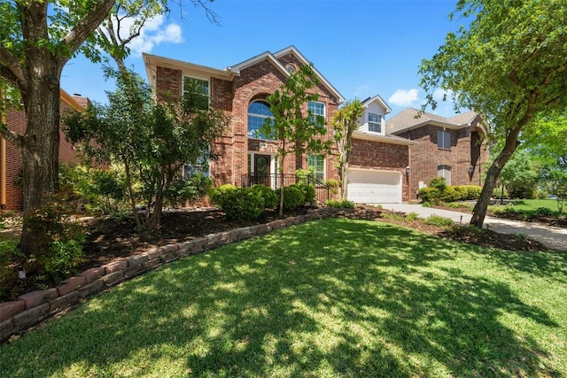 traditional home with a garage, brick siding, a front lawn, and concrete driveway