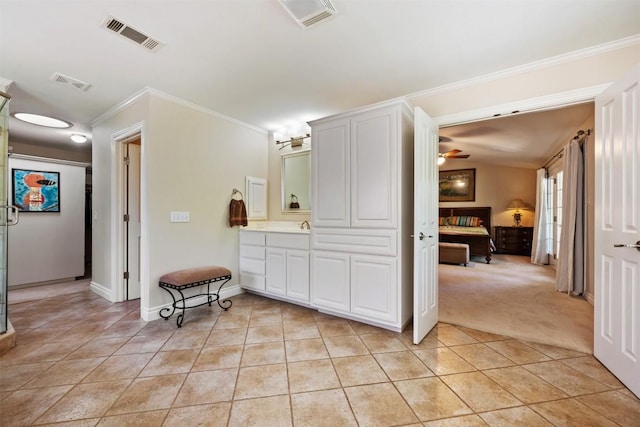 6425 Yaupon Dr, Austin, TX 78759 - full bathroom with crown molding, vanity, tile patterned floors, and a ceiling fan