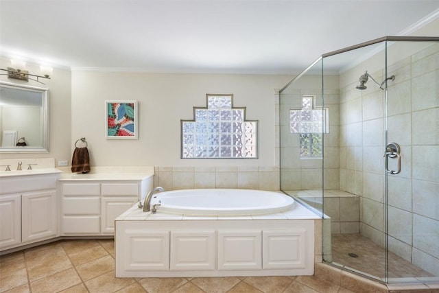6425 Yaupon Dr, Austin, TX 78759 - bathroom with vanity, a stall shower, a bath, tile patterned flooring, and crown molding