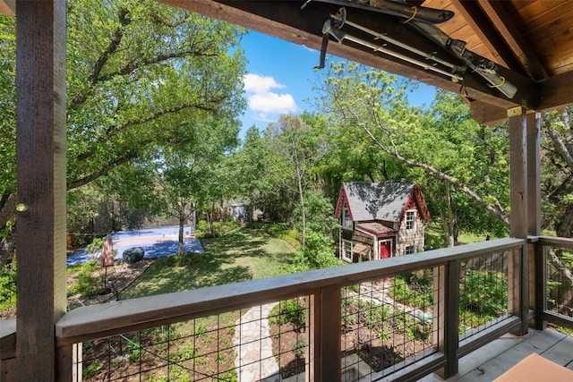 6425 Yaupon Dr, Austin, TX 78759 - wooden terrace featuring an outbuilding and view of scattered trees
