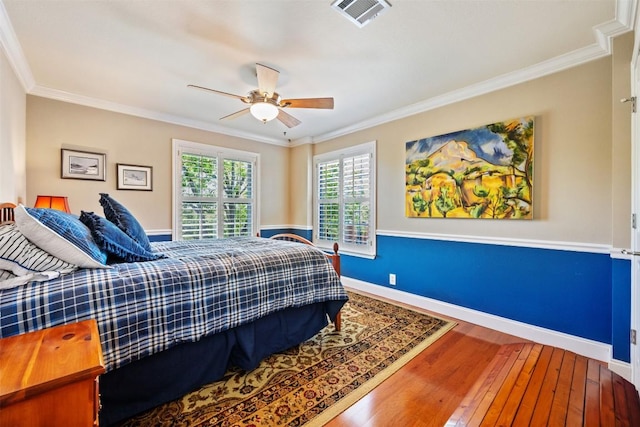 6425 Yaupon Dr, Austin, TX 78759 - bedroom with hardwood / wood-style flooring, ornamental molding, and a ceiling fan
