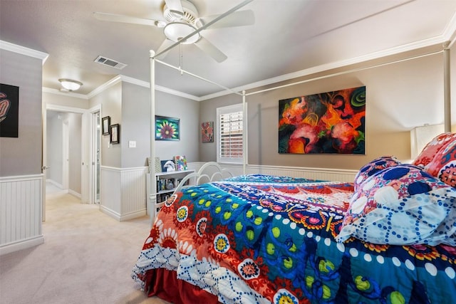 6425 Yaupon Dr, Austin, TX 78759 - carpeted bedroom with wainscoting, crown molding, and a ceiling fan