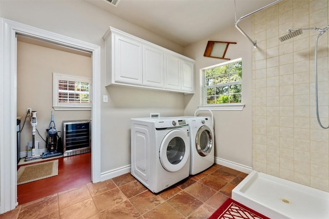 6425 Yaupon Dr, Austin, TX 78759 - laundry room with wine cooler, washing machine and dryer, and cabinet space