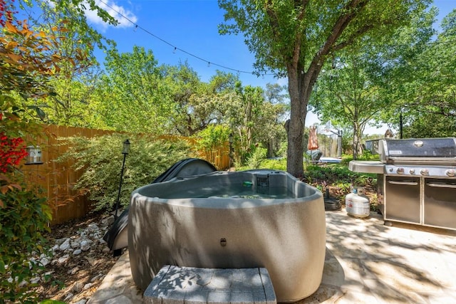 6425 Yaupon Dr, Austin, TX 78759 - view of patio featuring grilling area and a hot tub