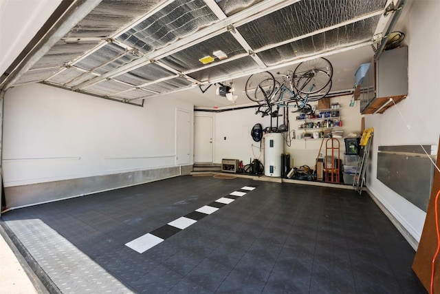 6425 Yaupon Dr, Austin, TX 78759 - garage featuring a garage door opener and electric water heater
