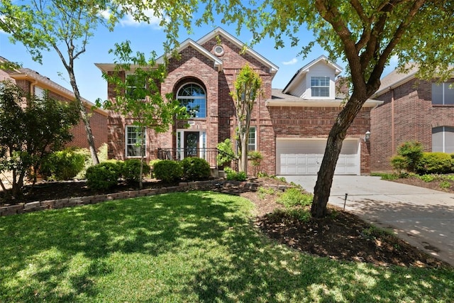 6425 Yaupon Dr, Austin, TX 78759 - traditional home featuring concrete driveway, a front yard, and brick siding