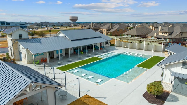 view of pool featuring fence, a fenced in pool, a residential view, and a patio