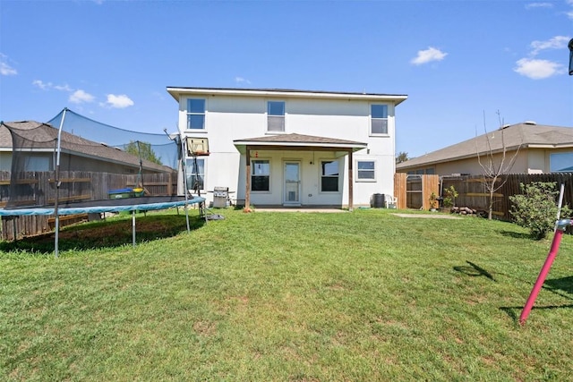 12833 Carillon Way, Manor, TX 78653 - rear view of property featuring a trampoline, a patio area, stucco siding, and cooling unit