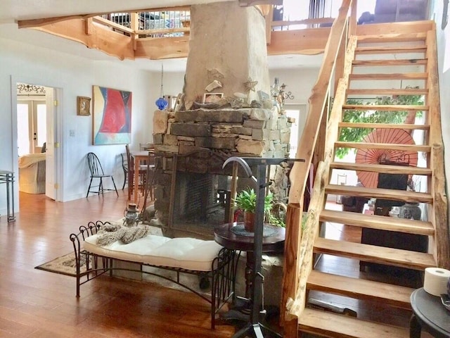 156 Lazy Leaf Ln, Wimberley, TX 78676 - stairway featuring wood finished floors and a fireplace