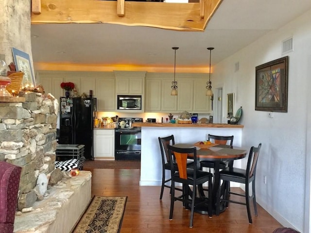 156 Lazy Leaf Ln, Wimberley, TX 78676 - dining space with dark wood finished floors