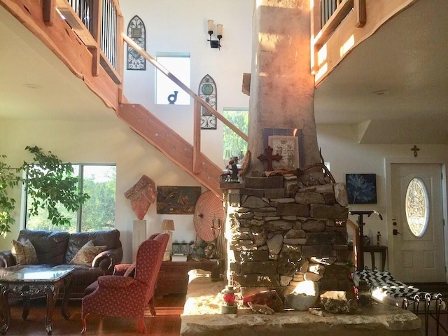 156 Lazy Leaf Ln, Wimberley, TX 78676 - living area featuring stairs, wood finished floors, and a high ceiling