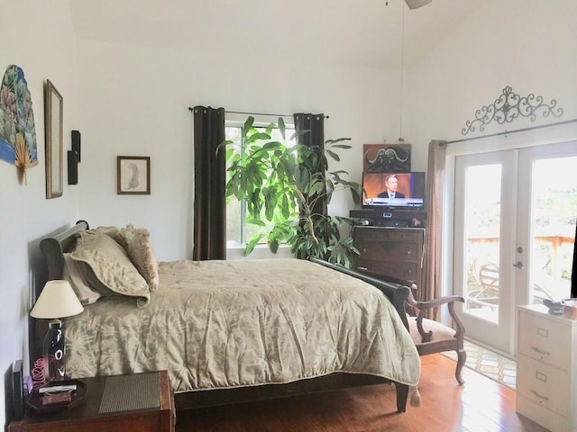 156 Lazy Leaf Ln, Wimberley, TX 78676 - bedroom with access to outside, french doors, and wood finished floors