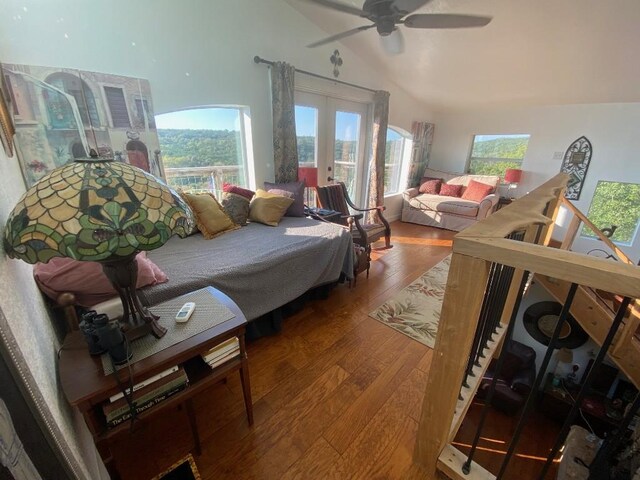 156 Lazy Leaf Ln, Wimberley, TX 78676 - living room featuring french doors, wood finished floors, ceiling fan, and high vaulted ceiling