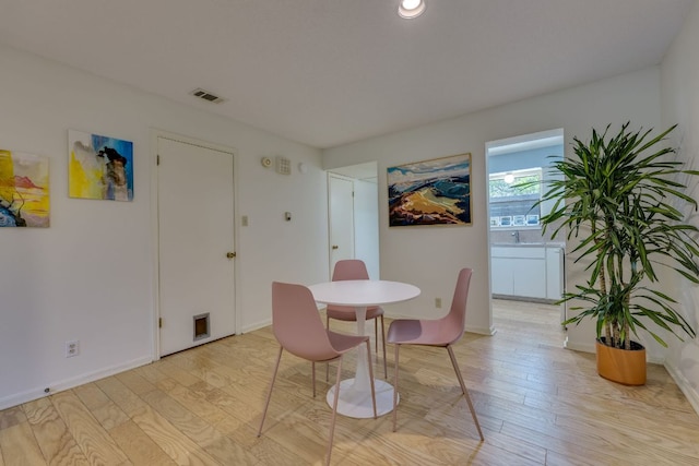 9226 Jollyville Rd Unit 132, Austin, TX 78759 - dining space featuring light wood-style floors and baseboards