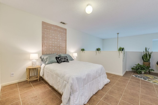 9226 Jollyville Rd Unit 132, Austin, TX 78759 - bedroom with tile patterned flooring and baseboards