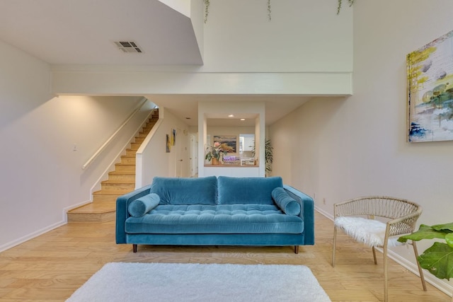 9226 Jollyville Rd Unit 132, Austin, TX 78759 - living area featuring stairs, wood finished floors, and baseboards