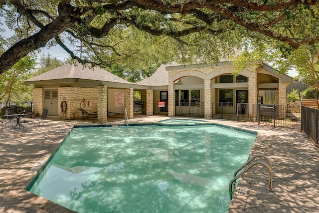 9226 Jollyville Rd Unit 132, Austin, TX 78759 - view of swimming pool featuring a patio and a pool with connected hot tub