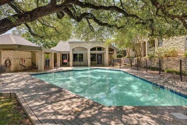 9226 Jollyville Rd Unit 132, Austin, TX 78759 - view of pool with a pool with connected hot tub and a patio area