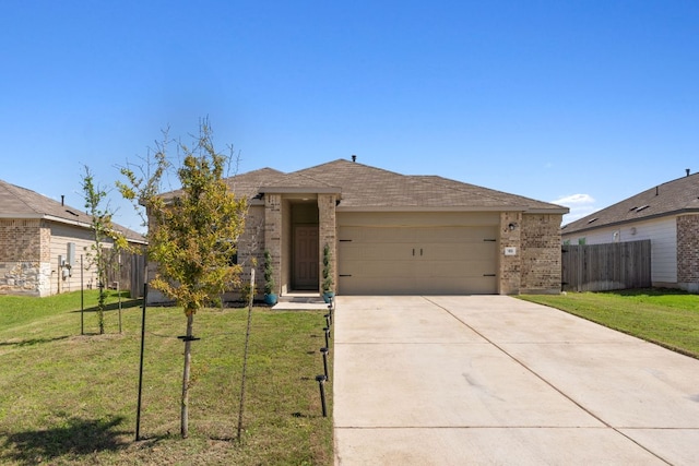 185 Silver Springs Bnd, Kyle, TX 78640 - ranch-style house featuring driveway, a garage, brick siding, fence, and a front lawn