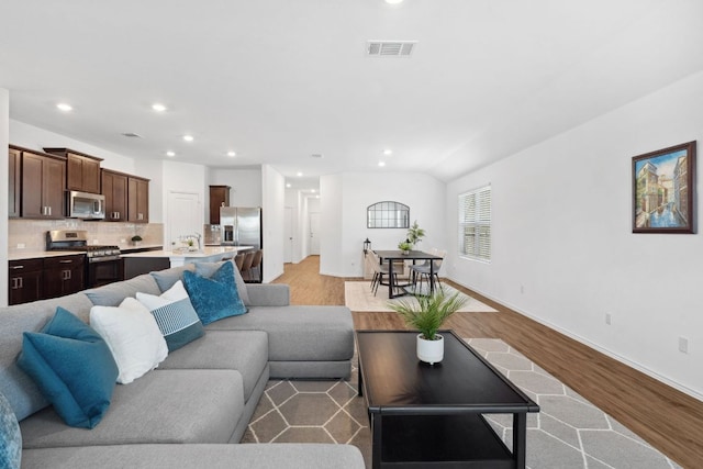 185 Silver Springs Bnd, Kyle, TX 78640 - living area featuring recessed lighting, baseboards, light wood finished floors, and visible vents
