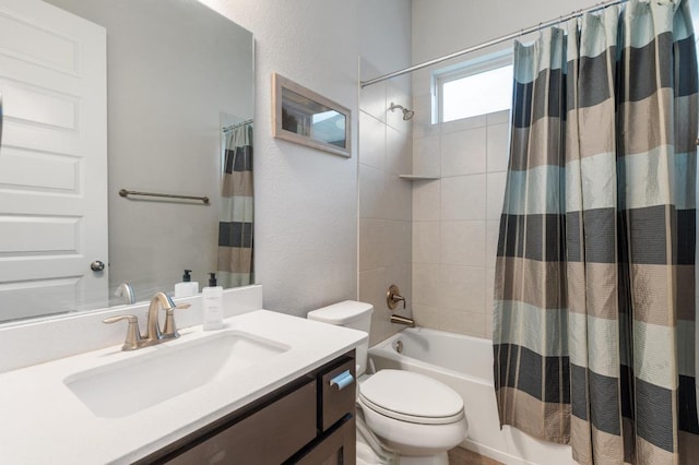 bathroom featuring vanity, shower / bath combination with curtain, and toilet