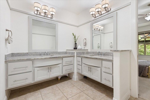 15213 Falconhead Grove Loop, Austin, TX 78738 - ensuite bathroom with two vanities and tile patterned floors