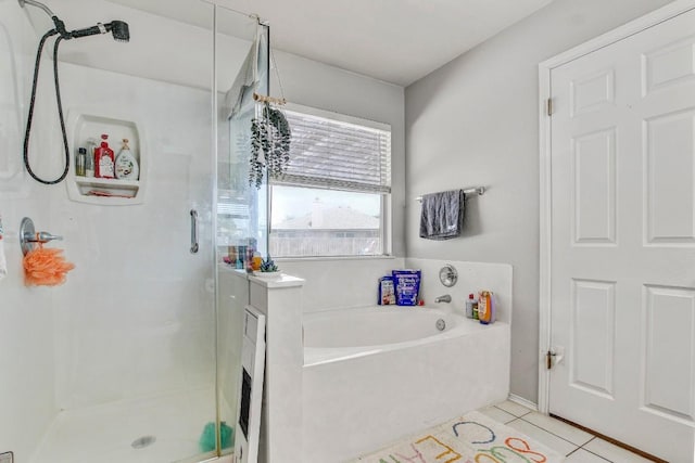 full bath with a bath, tile patterned flooring, and a stall shower
