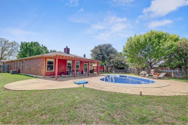 view of swimming pool with a fenced backyard, a patio area, a fenced in pool, and a lawn