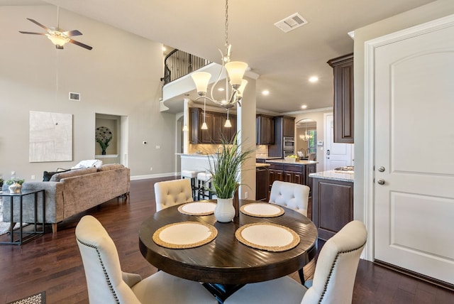 3817 Benetton Way, Leander, TX 78641 - dining space with dark wood-type flooring, a ceiling fan, recessed lighting, a chandelier, and arched walkways