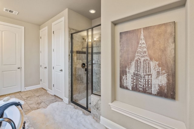3817 Benetton Way, Leander, TX 78641 - full bath featuring a shower stall, baseboards, and marble look tile flooring