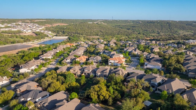 3817 Benetton Way, Leander, TX 78641 - aerial view of property's location featuring nearby suburban area, a large body of water, and a forest