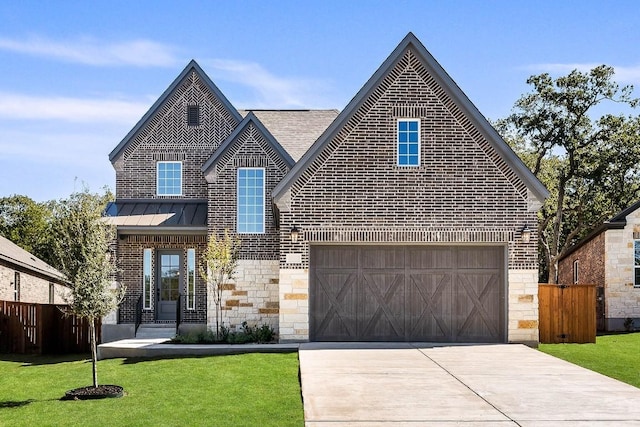view of front of property featuring stone siding, fence, brick siding, and driveway
