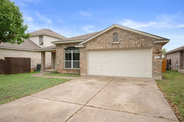 view of front of property with driveway, a front lawn, brick siding, a garage, and fence