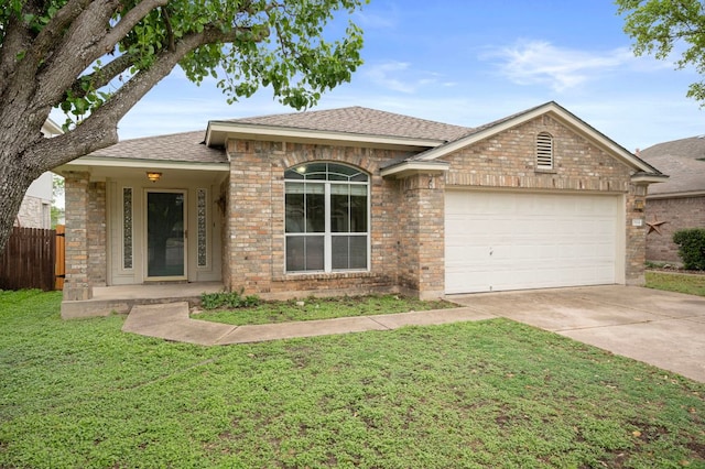 ranch-style house with a front yard, a shingled roof, an attached garage, fence, and concrete driveway