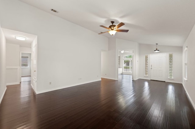 unfurnished living room featuring visible vents, dark wood-style flooring, vaulted ceiling, and ceiling fan