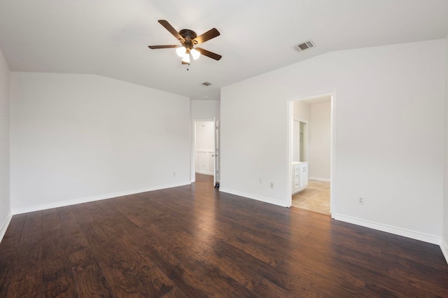 unfurnished room with a ceiling fan, vaulted ceiling, visible vents, wood finished floors, and baseboards