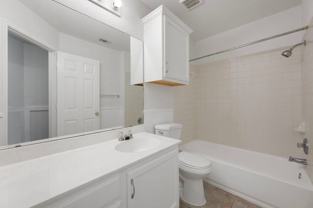 full bath featuring toilet, tile patterned floors, vanity, and visible vents
