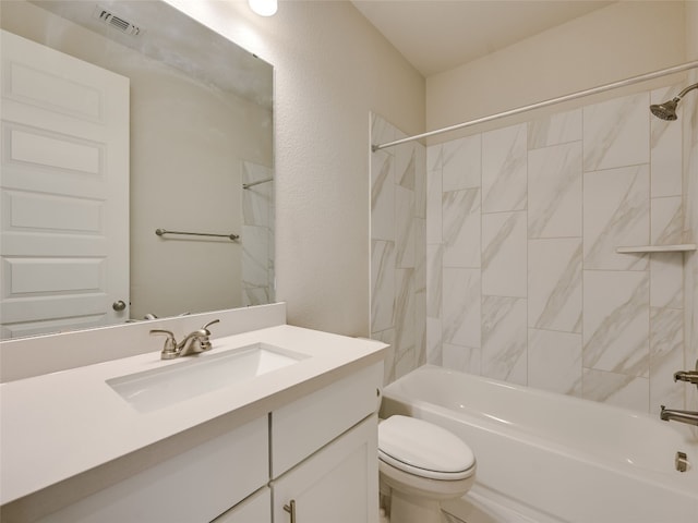 bathroom featuring vanity, visible vents, toilet, and tub / shower combination