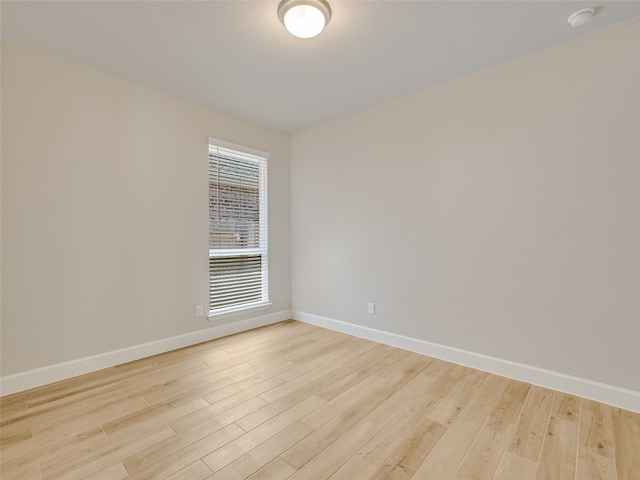 unfurnished room featuring light wood-style floors and baseboards
