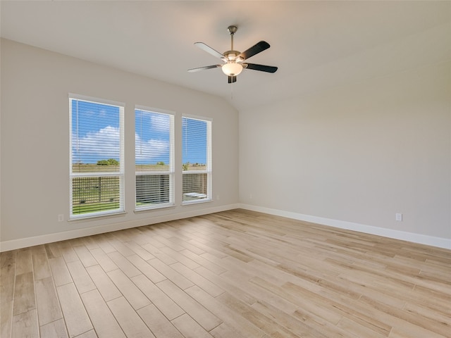 unfurnished room featuring baseboards, light wood-type flooring, and ceiling fan