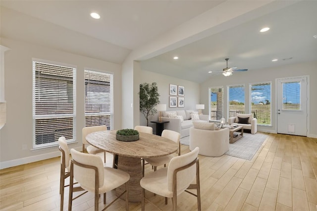 dining space featuring lofted ceiling, light wood-style floors, ceiling fan, baseboards, and recessed lighting